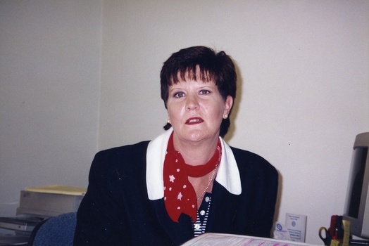 Peta Nagle, Board Director, at a desk