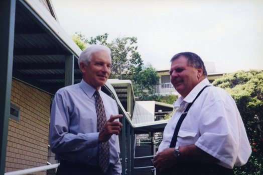 Peter Lynam and Kevin O'Mahoney outside a building