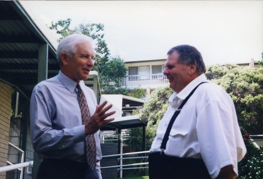 Peter Lynam and Kevin O'Mahoney outside a building