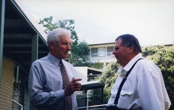 Peter Lynam and Kevin O'Mahoney outside a building