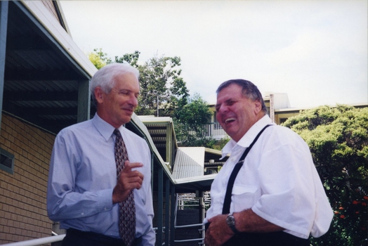 Peter Lynam and Kevin O'Mahoney outside a building