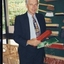 Peter Lynam, First Chief Executive Officer of Vision QLD, holding brushes