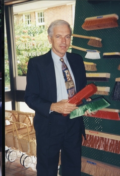 Peter Lynam, First Chief Executive Officer of Vision QLD, holding brushes