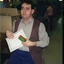 Michael Box holding Jenny Scown's certificate and QBIC frog award