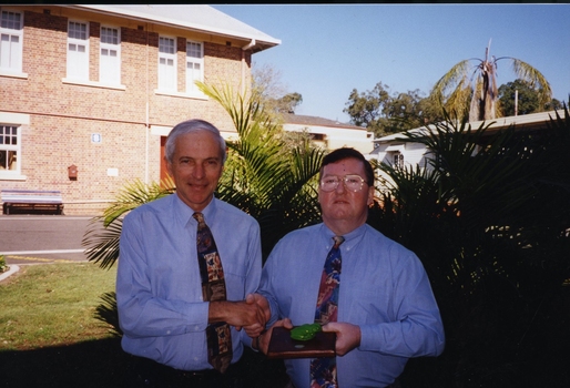 Peter Lynam presenting John Johnson with his award