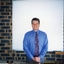 Nigel Irwin in front of a projector screen
