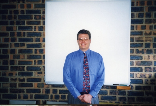 Nigel Irwin in front of a projector screen