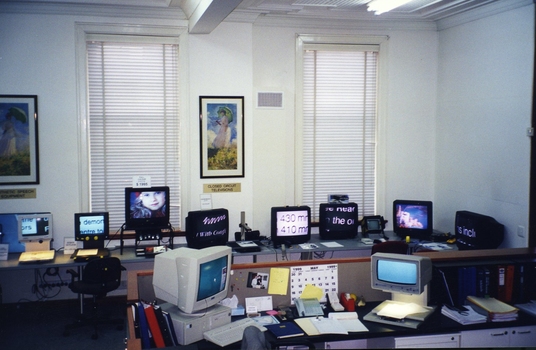 Reception area with various types of screen readers and large print magnifiers displayed