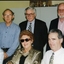Six unidentified people pose for the camera