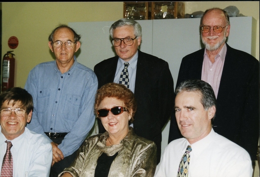 Six unidentified people pose for the camera