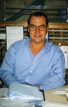 Unidentified man sitting at a desk