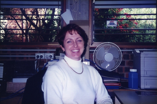 Margaret Ford sitting at a computer screen