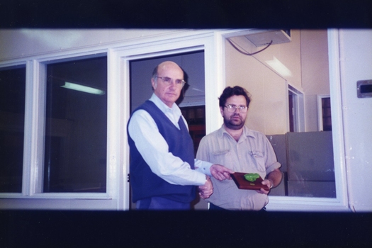 Unidentified men during an award presentation