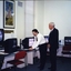 Peter Lynam with an unidentified man at the screen magnifier display 