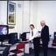 Peter Lynam with an unidentified man at the screen magnifier display 