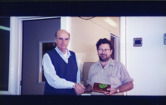 Unidentified men during an award presentation