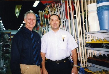 Herb with hardware store staff member