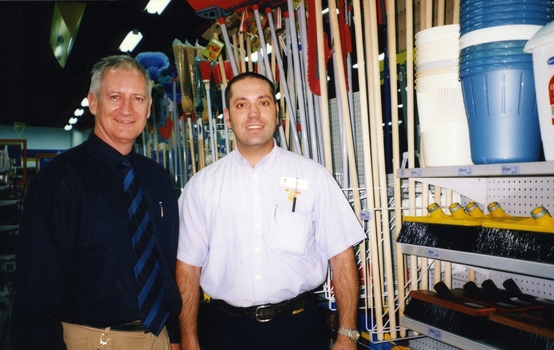 Herb with hardware store staff member