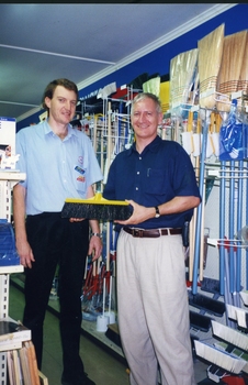 Herb with hardware store staff member