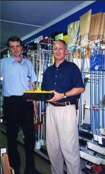 Herb with hardware store staff member