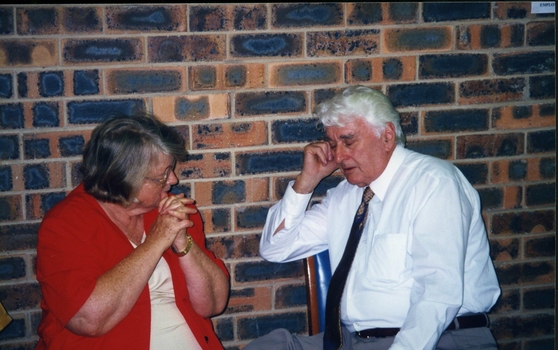 Des Knight and unidentified woman at the book launch