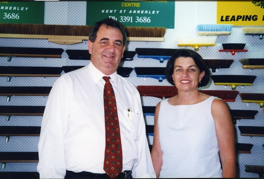 John Puttick stands with Anna Bligh in front of brush head wall