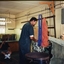 Alan Nemeth making brooms in the factory