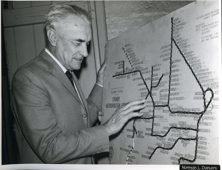 Man reads Braille labels of tactile map of Sydney Metro Trains area