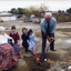 Mary Tiernan and her family look on as Rex Hollioake turns the sod