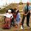 Mary Tiernan and her family look on as Rex Hollioake turns the sod
