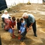 Mary Tiernan and her family look on as Rex Hollioake turns the sod