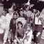 Four adults dressed as clowns with some children