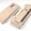 Beige rectangle box with cream buttons and silver return lever