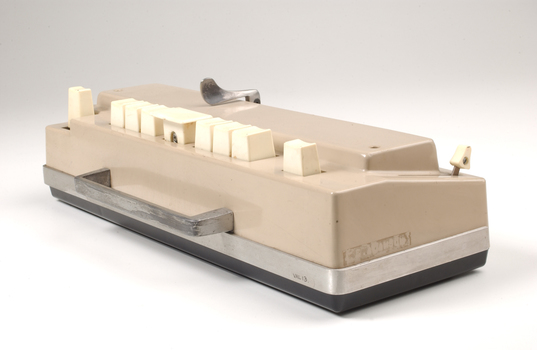 Beige rectangle box with cream buttons and silver return lever