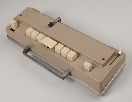 Beige rectangle box with cream buttons and silver return lever