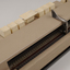 Beige rectangle box with cream buttons and silver return lever