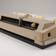 Beige rectangle box with cream buttons and silver return lever