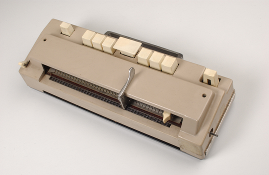 Beige rectangle box with cream buttons and silver return lever
