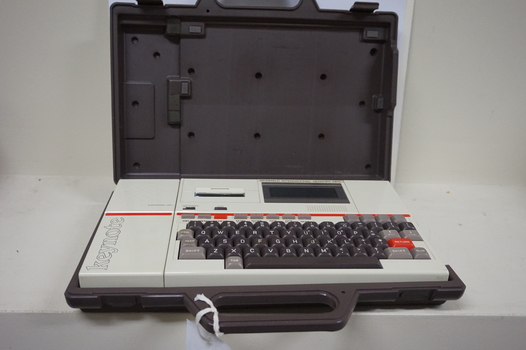 Cream keyboard with brown keys, 'Keynote' written on side, red line and cassette unit above keys