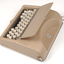 Tan case with flip top lid exposing keyboard, and red handle strap