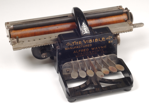 Black brailler with metal keys and wooden roller