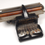 Black brailler with metal keys and wooden roller