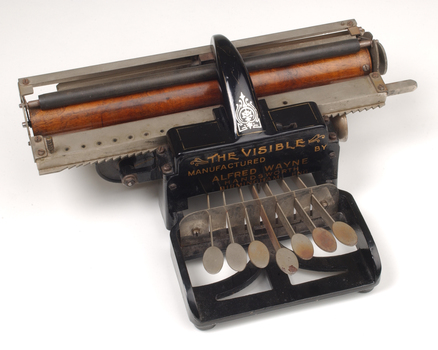 Black brailler with metal keys and wooden roller