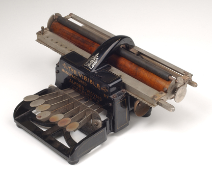 Black brailler with metal keys and wooden roller
