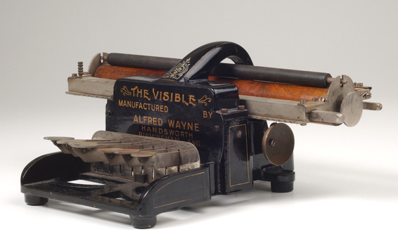 Black brailler with metal keys and wooden roller