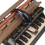 Piano like keyboard on black iron base with metal rollers
