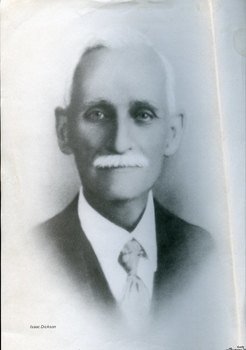 Portrait of man with white hair and moustache in suit and tie