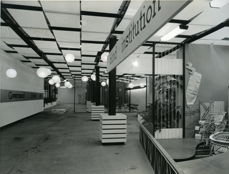 Open floor area with signage on left and cane objects