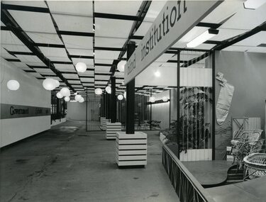 Open floor area with signage on left and cane objects