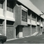 Double storey brick building with walkway to loading dock